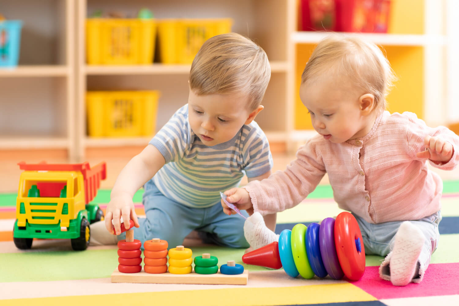 babies playing with toys