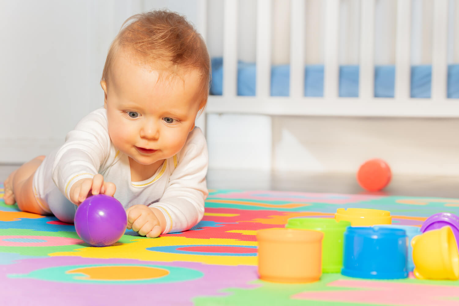 When Do Babies Start Grabbing Objects? - Being The Parent