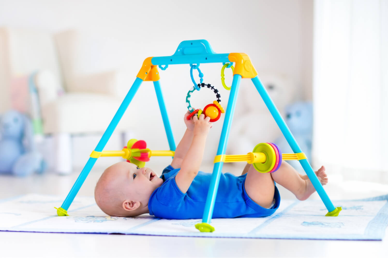 baby playing play gym