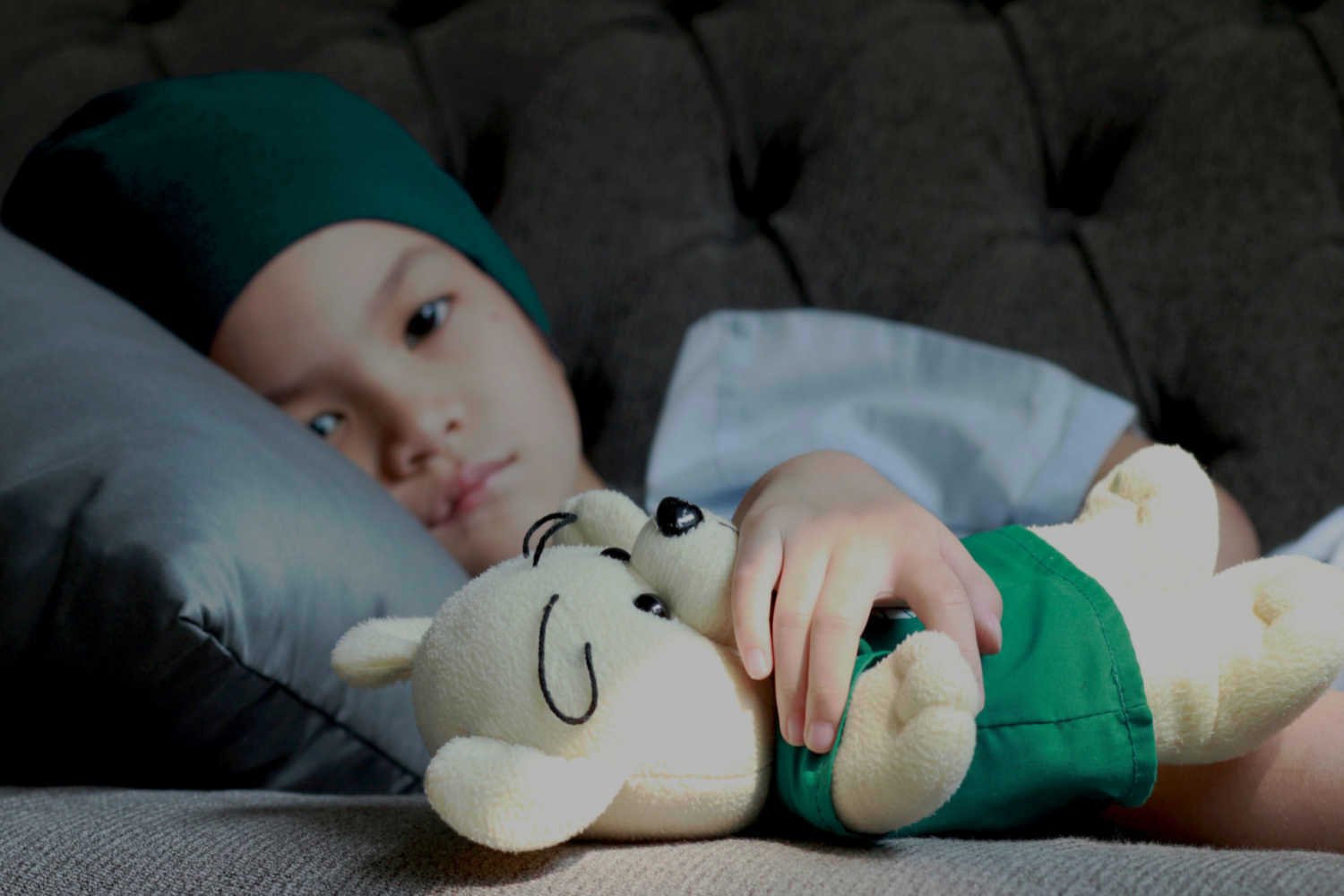sick child in sofa