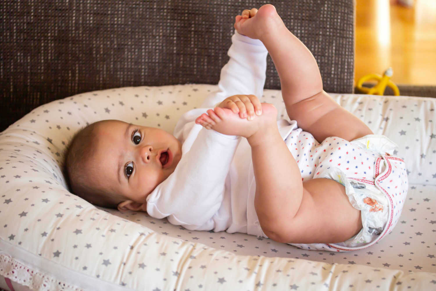 Rolling Over in Babies When it Develops & How to Encourage Being