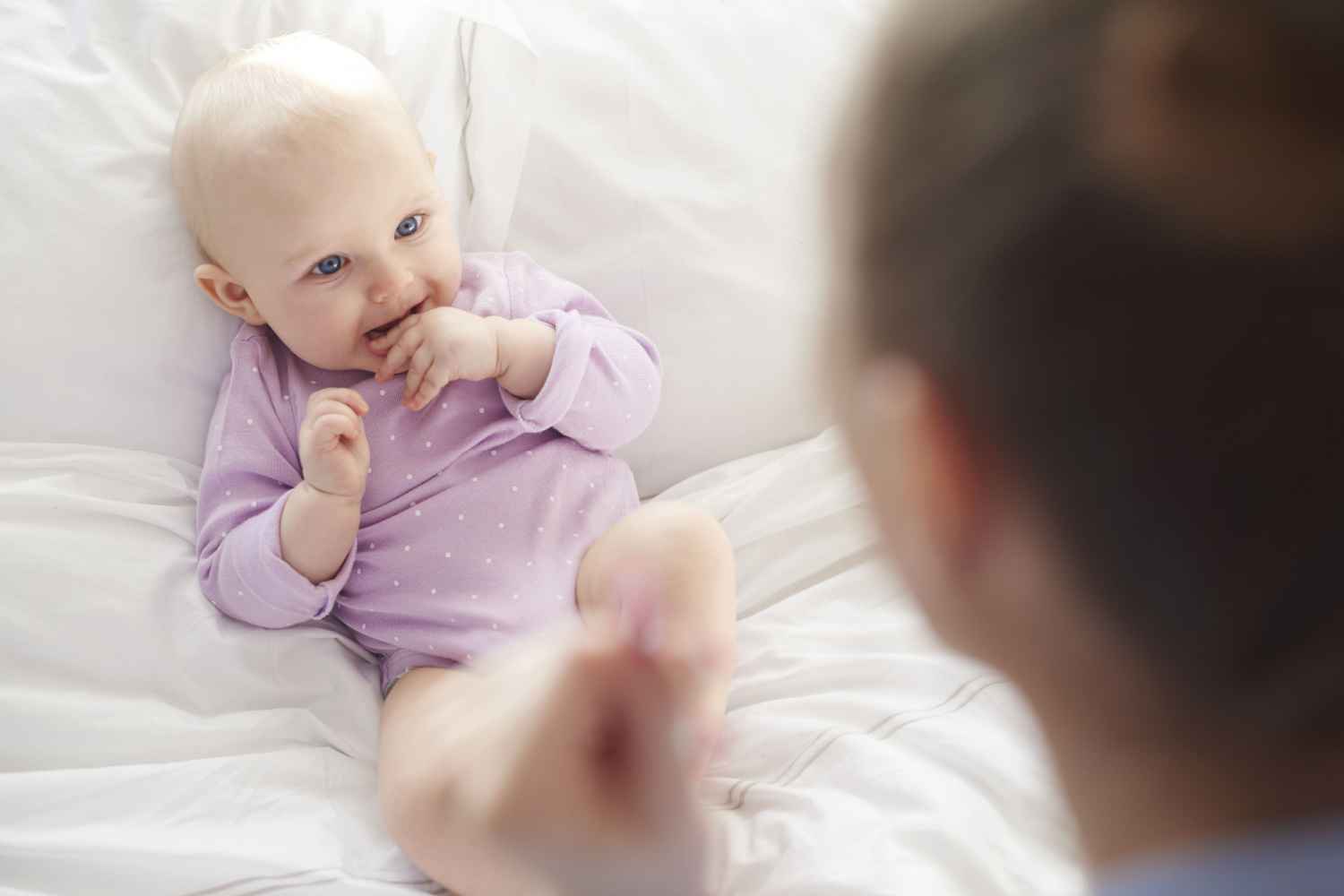 baby listening to mom singing rhyme