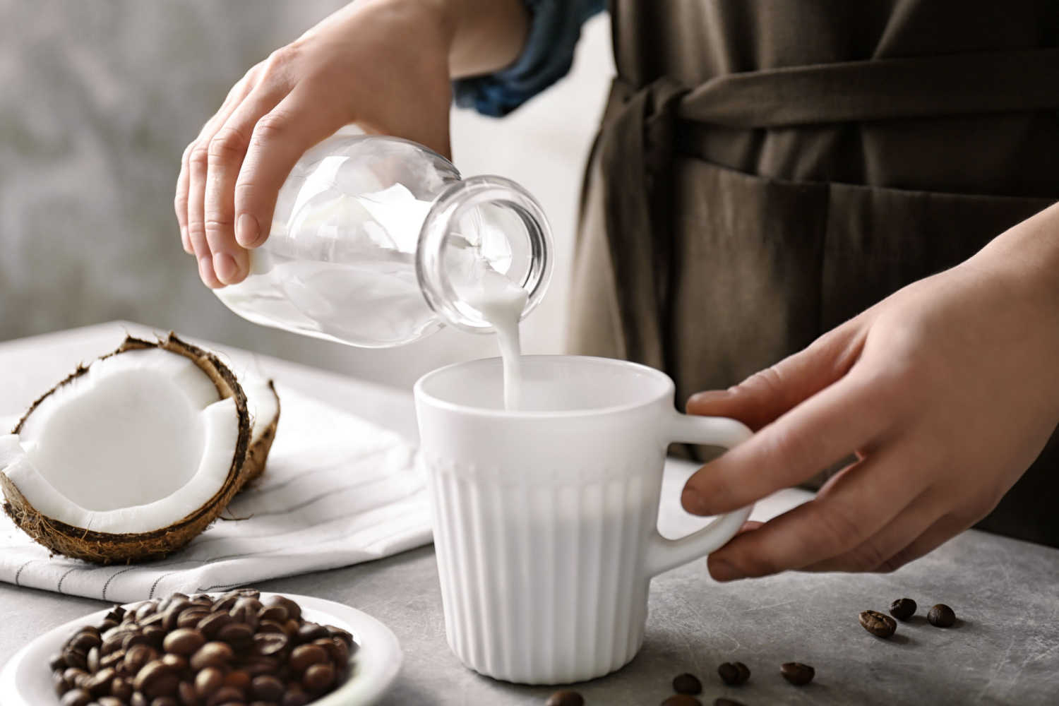 women pouring coconut milk