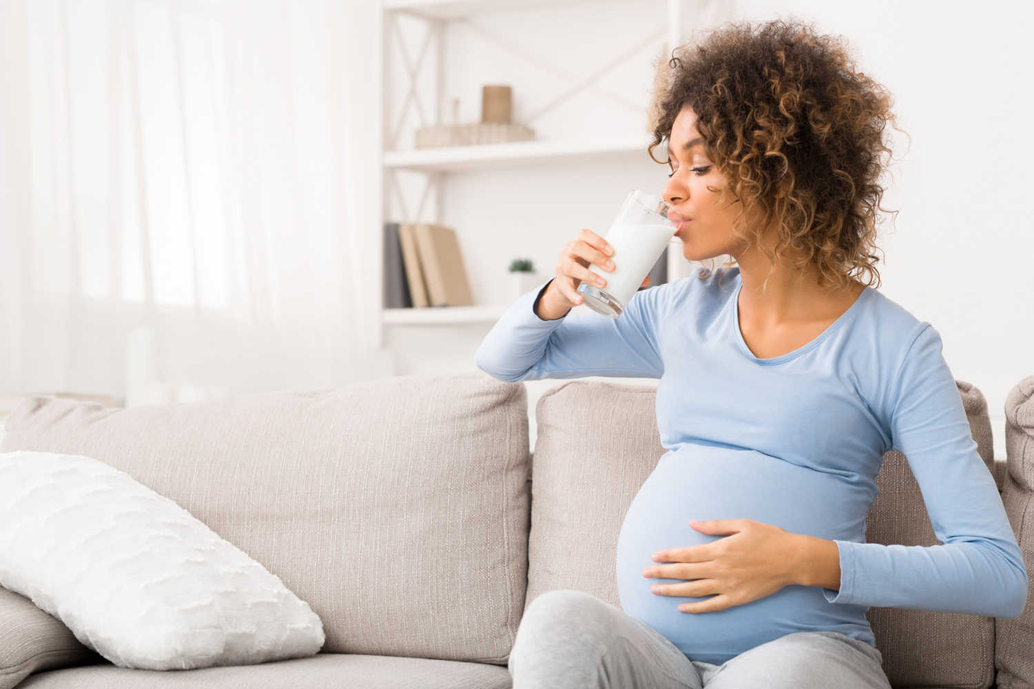 pregnant woman having nutrition drink