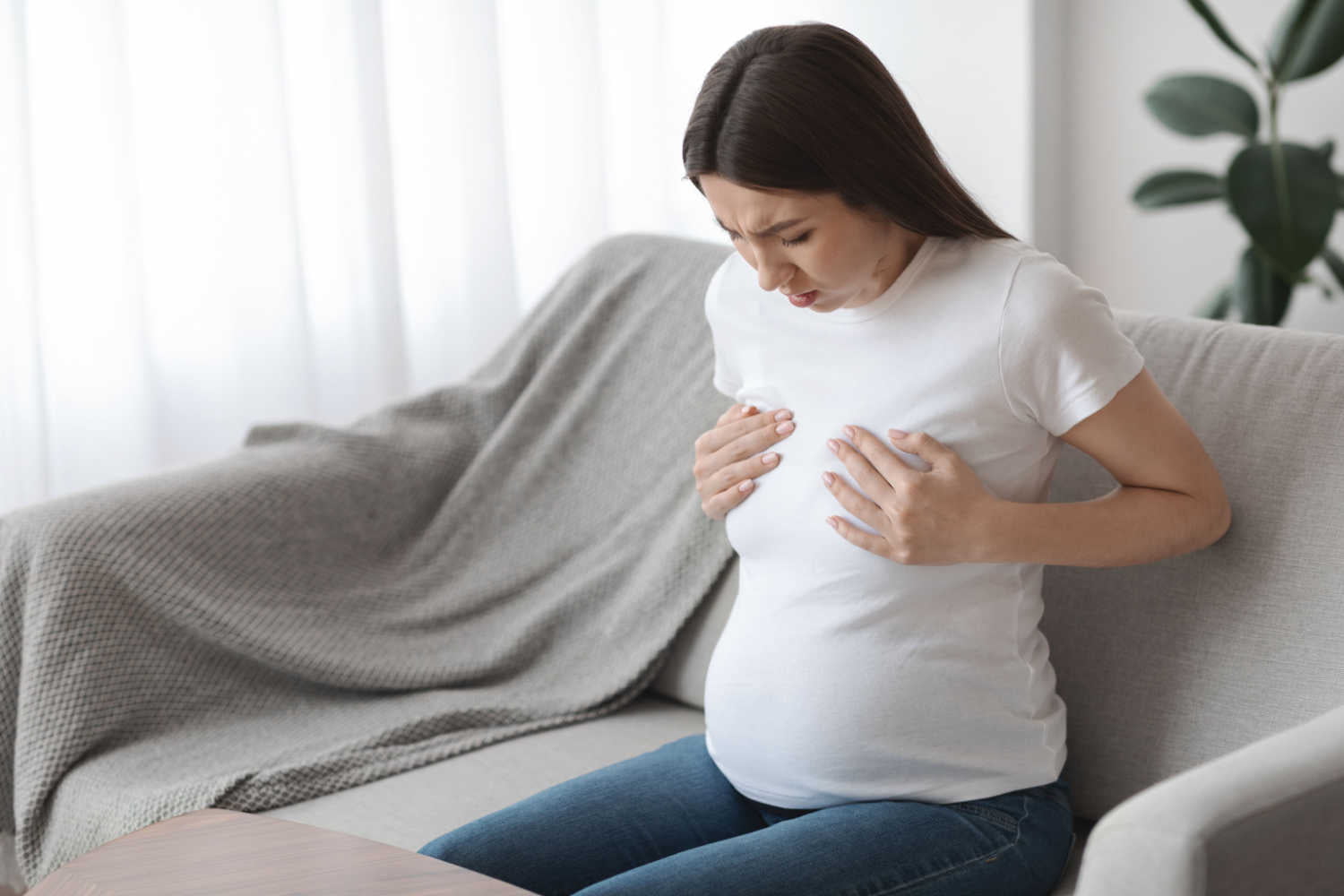woman having extreme breast pain