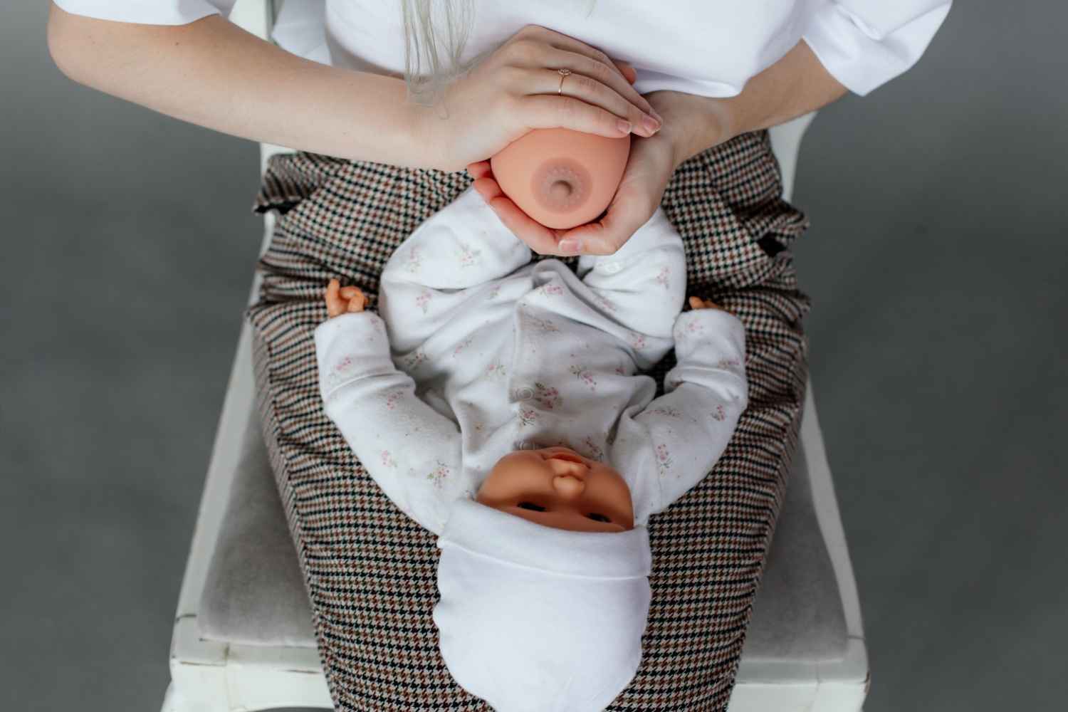 woman practicing breastfeeding