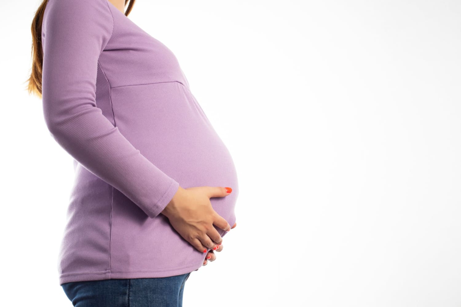 pregnant woman holding her baby bump