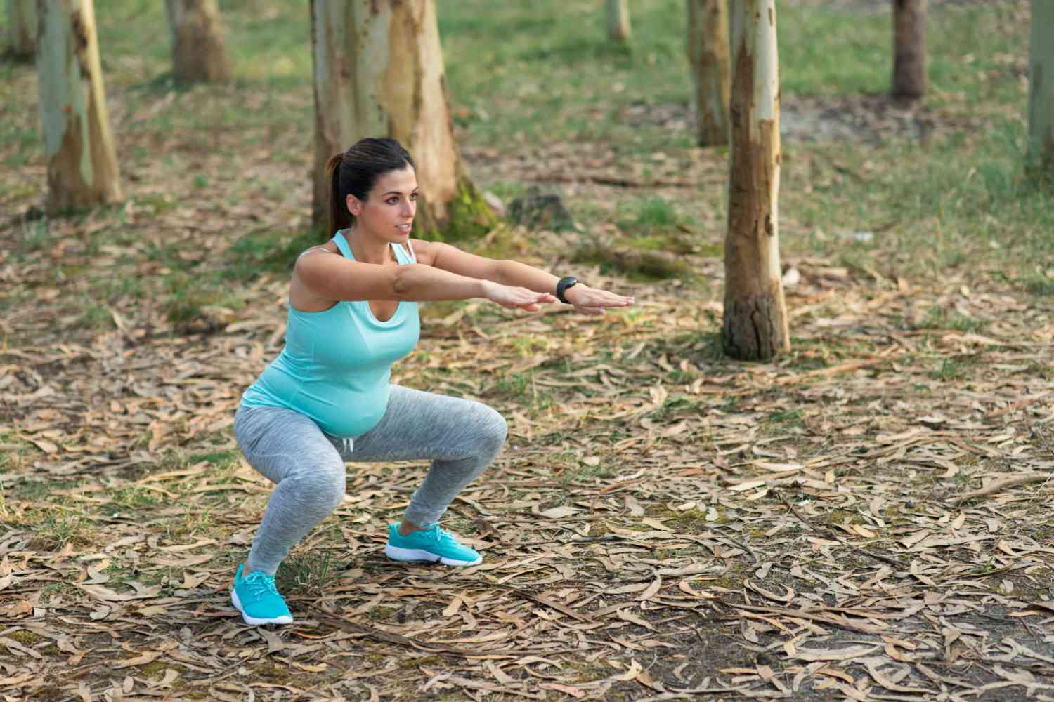 pregnant woman doing squats