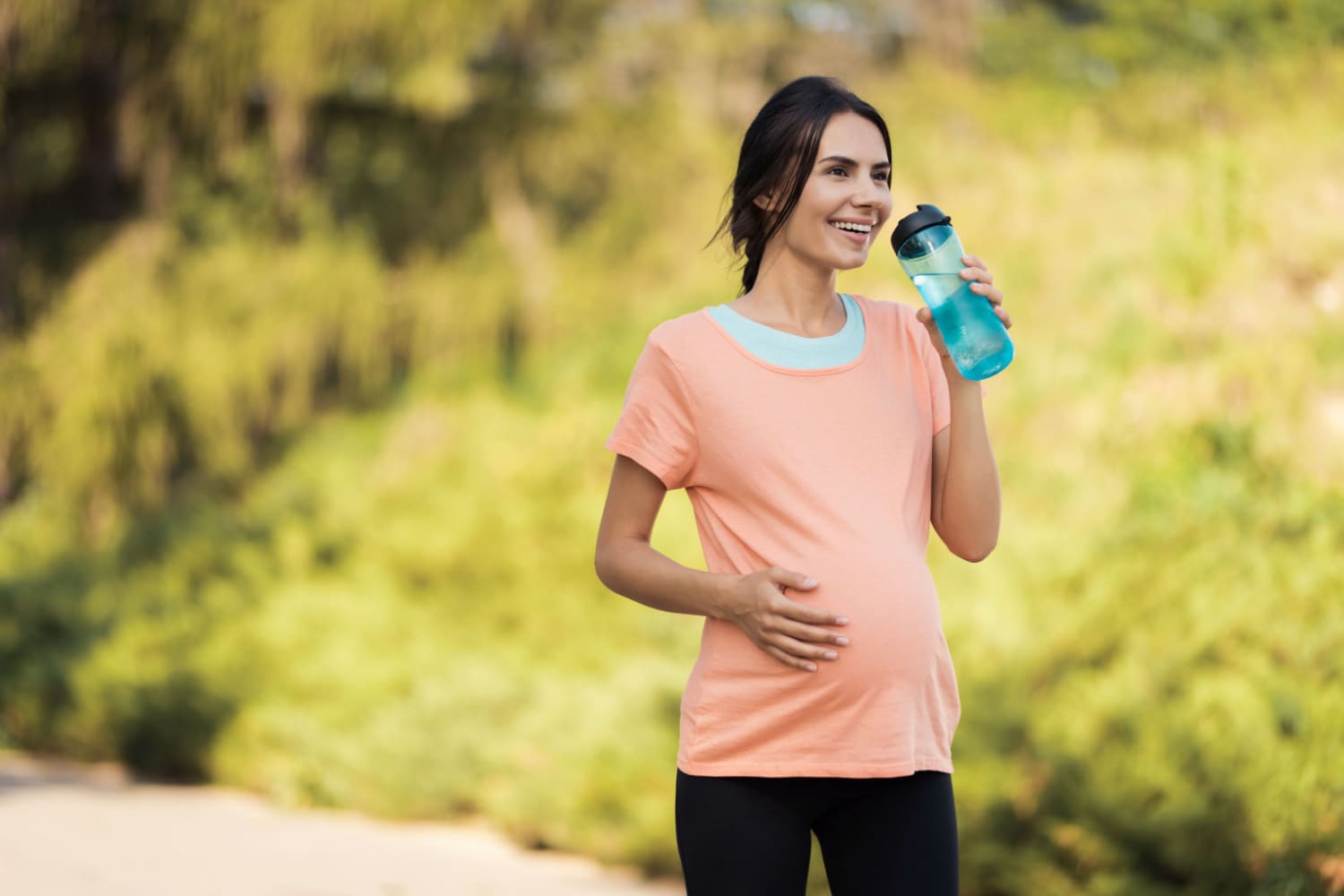 Pregnant woman drinking water