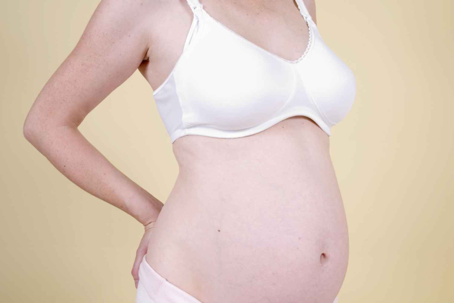 pregnant woman with visible veins on breasts