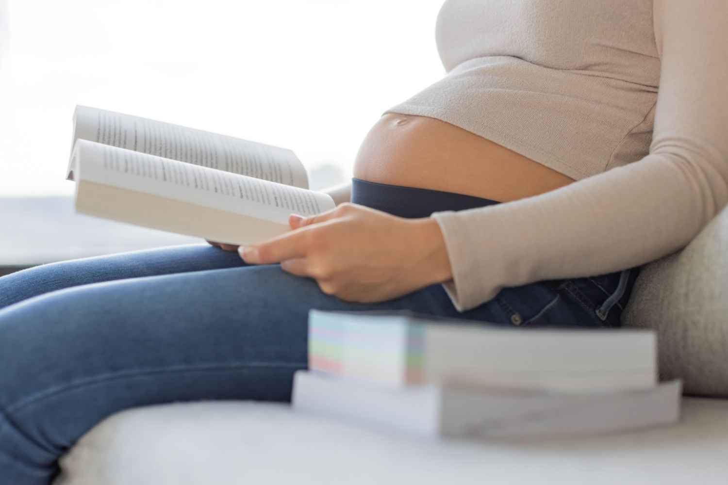 pregnant woman reading a book