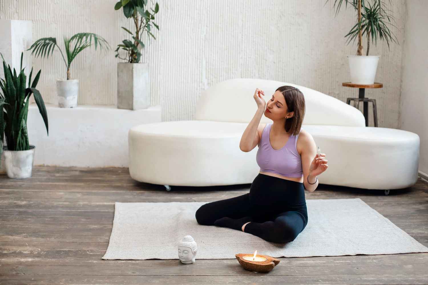 woman inhaling essential oil during pregnancy
