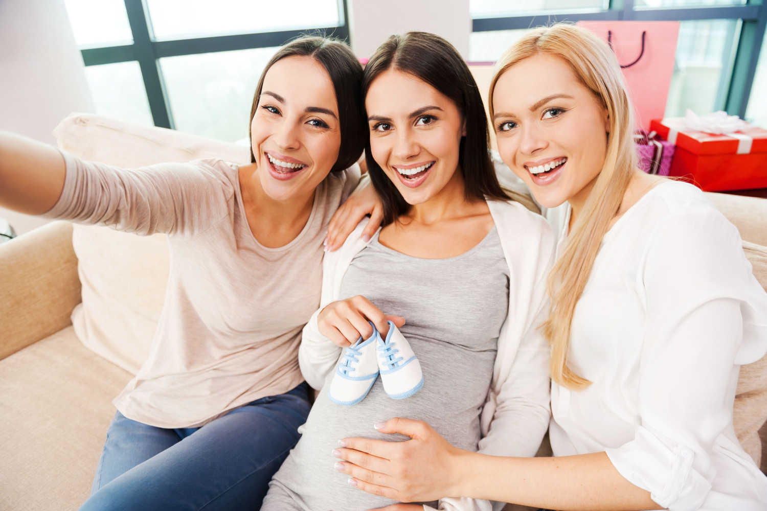 happy pregnant woman with friends