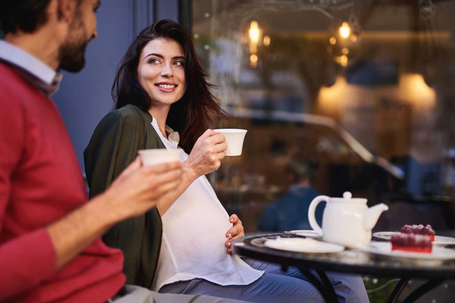 pregnant woman talking with her partner