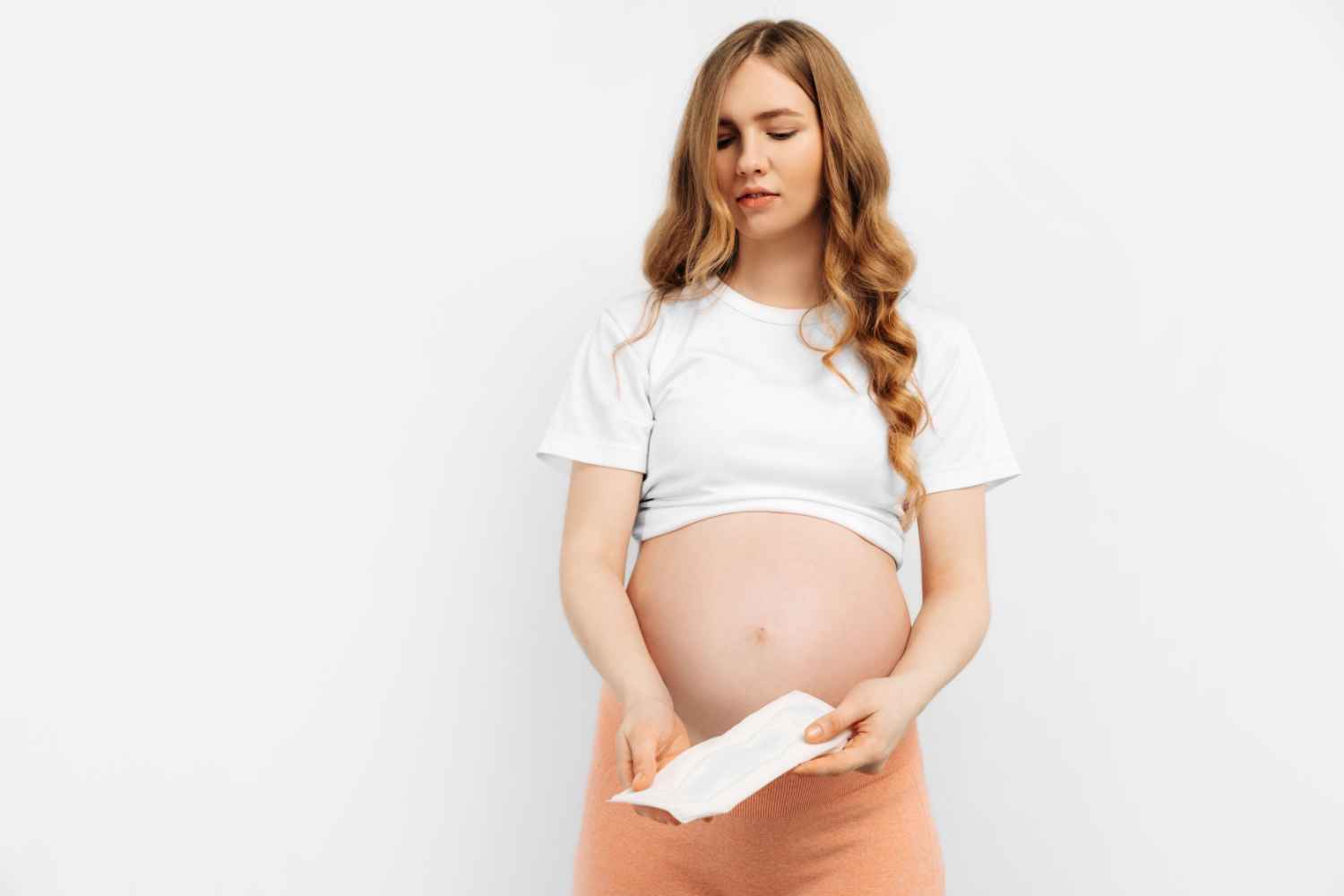 pregnant woman holding pad