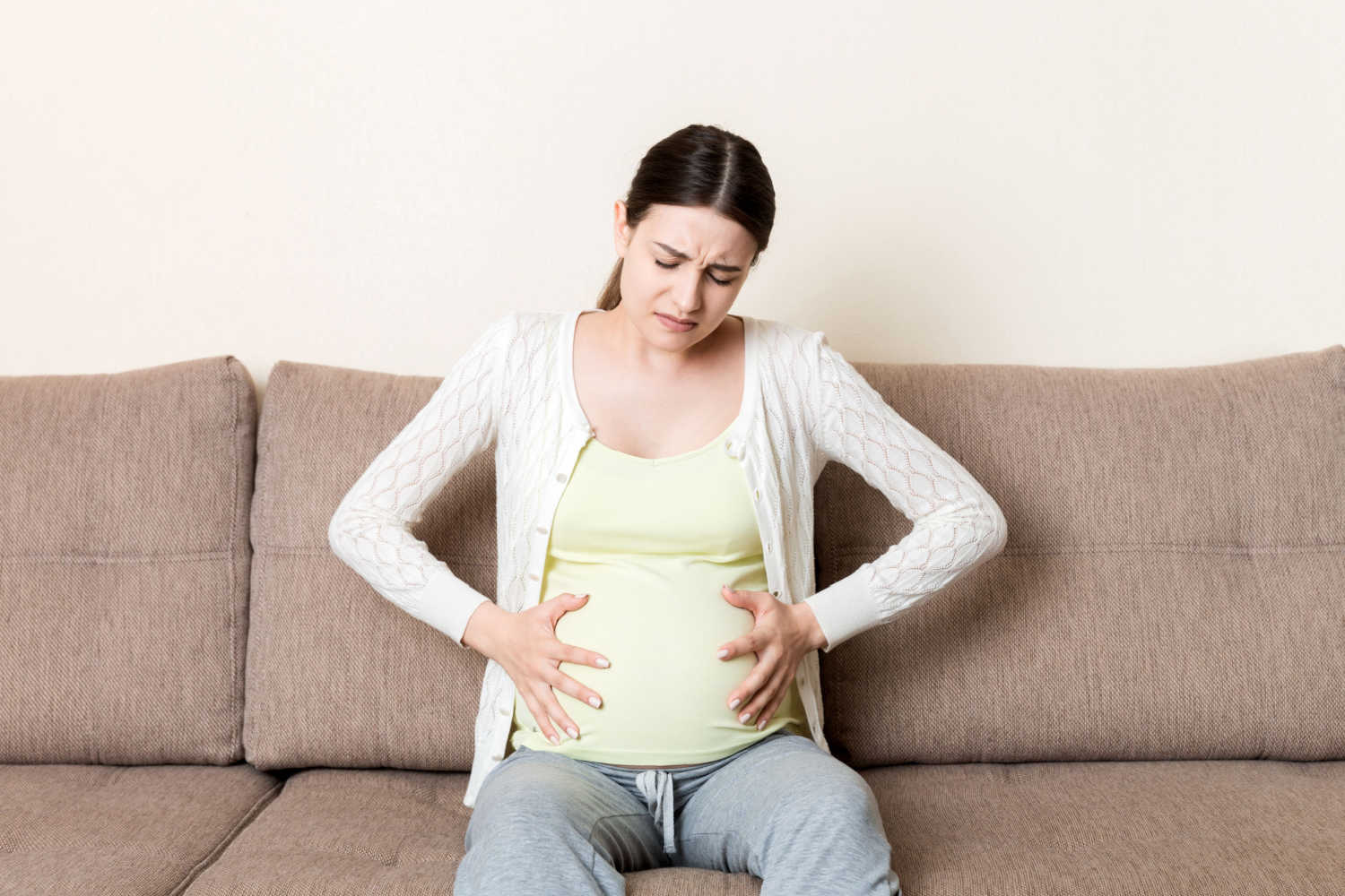 pregnant woman having discomfort
