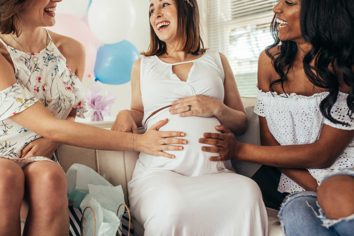 pregnant woman happy with friends