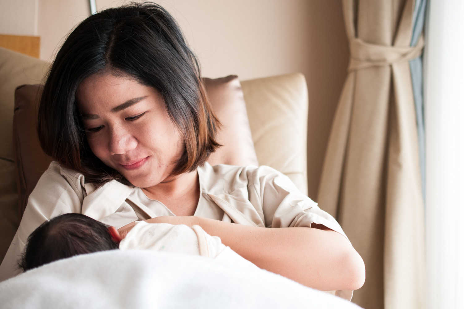 mother breastfeeding her baby