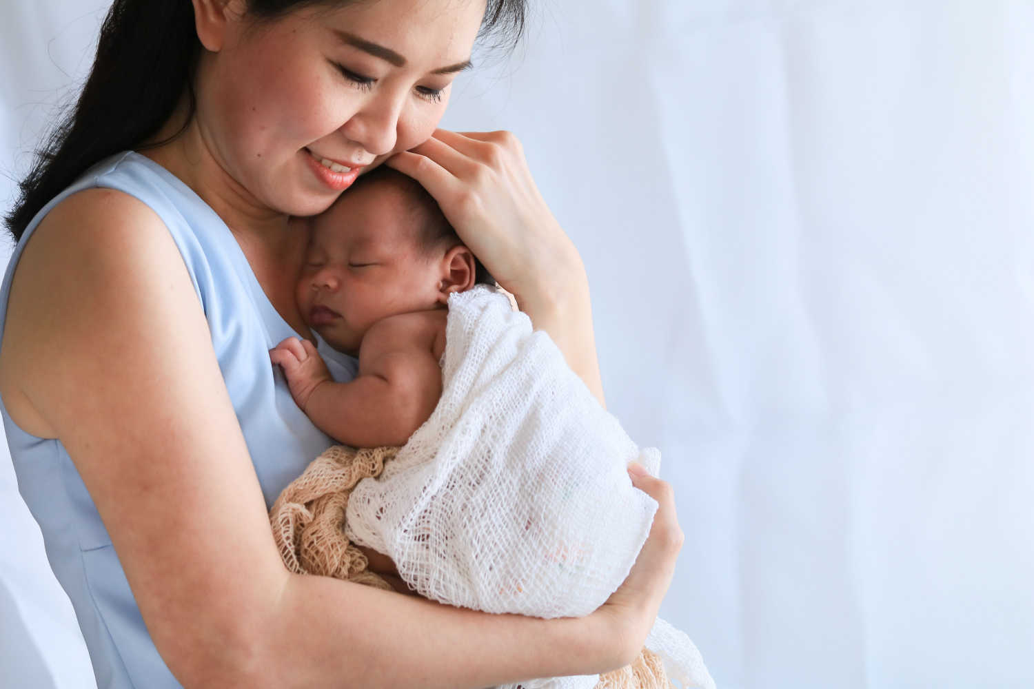 mother holding her baby