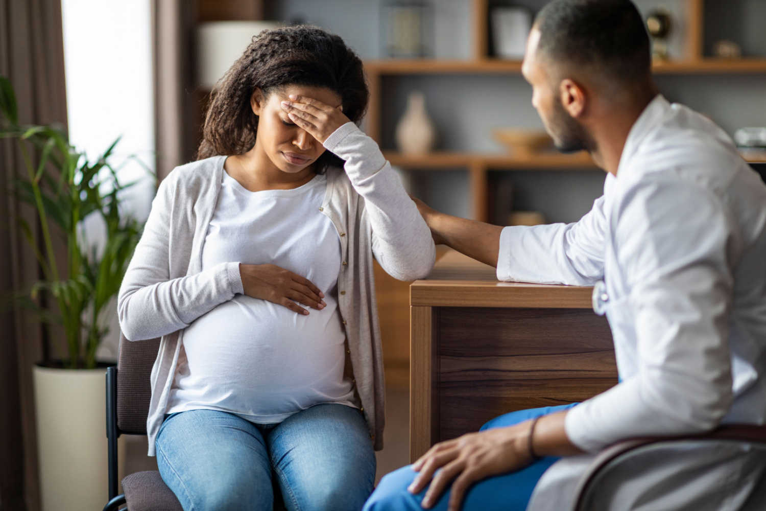 depressed pregnant woman talking with partner