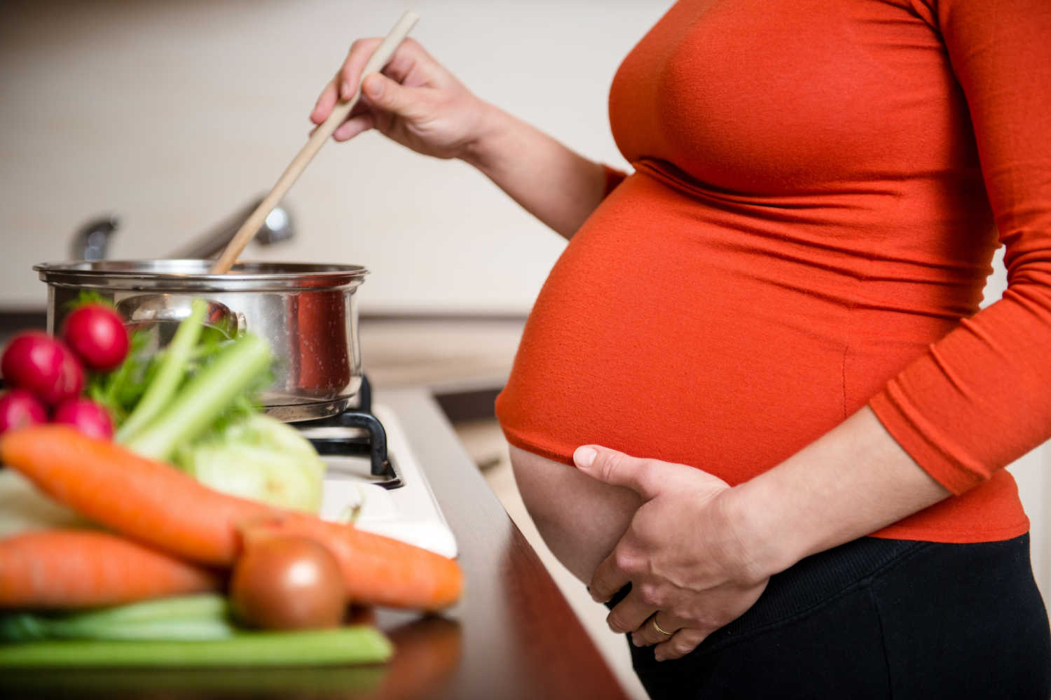 pregnant woman cooking