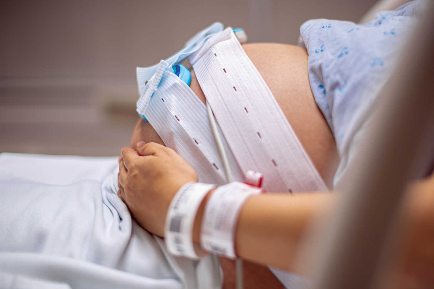 pregnant woman with fetal heart rate monitor 