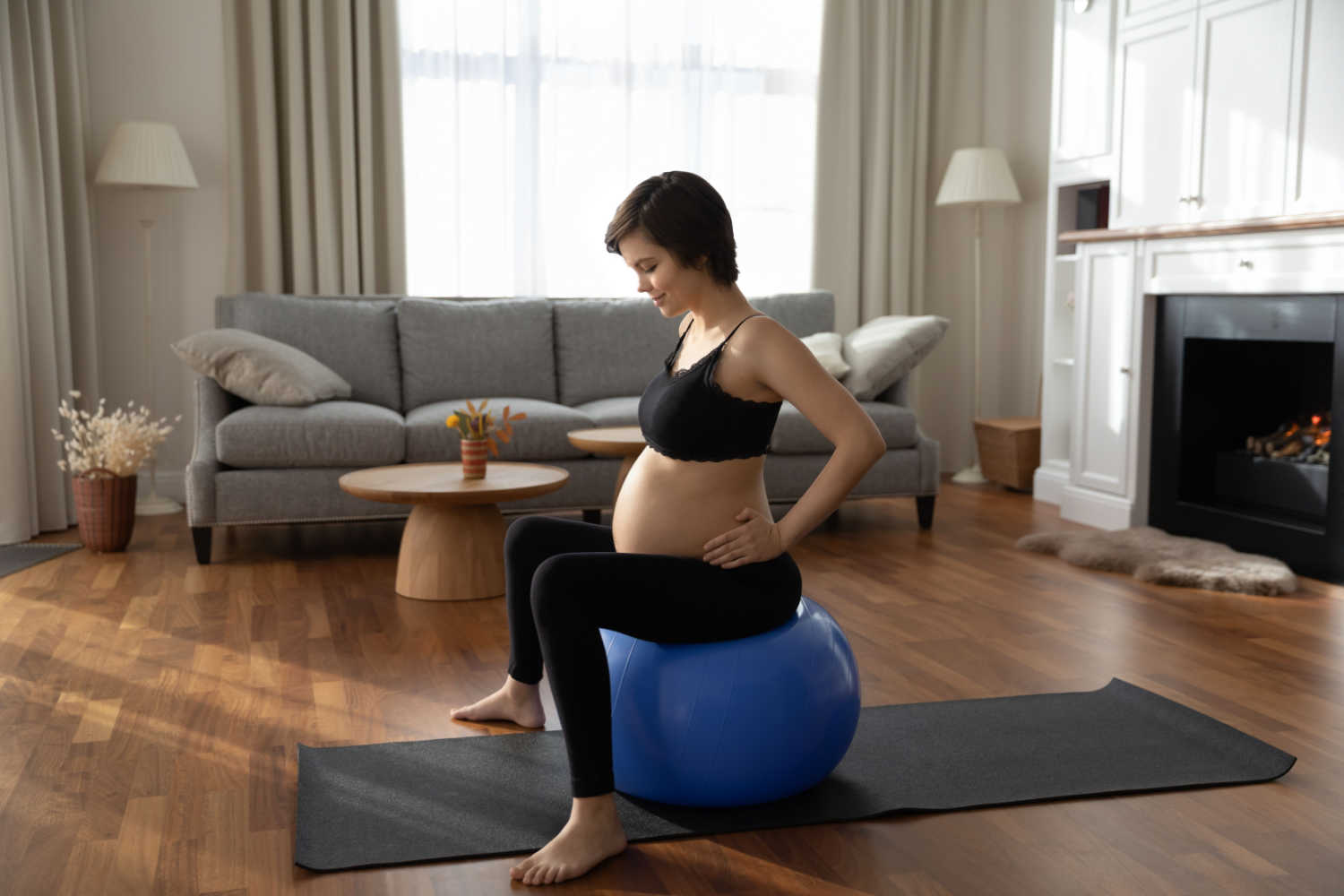 pregnant woman using birthing ball