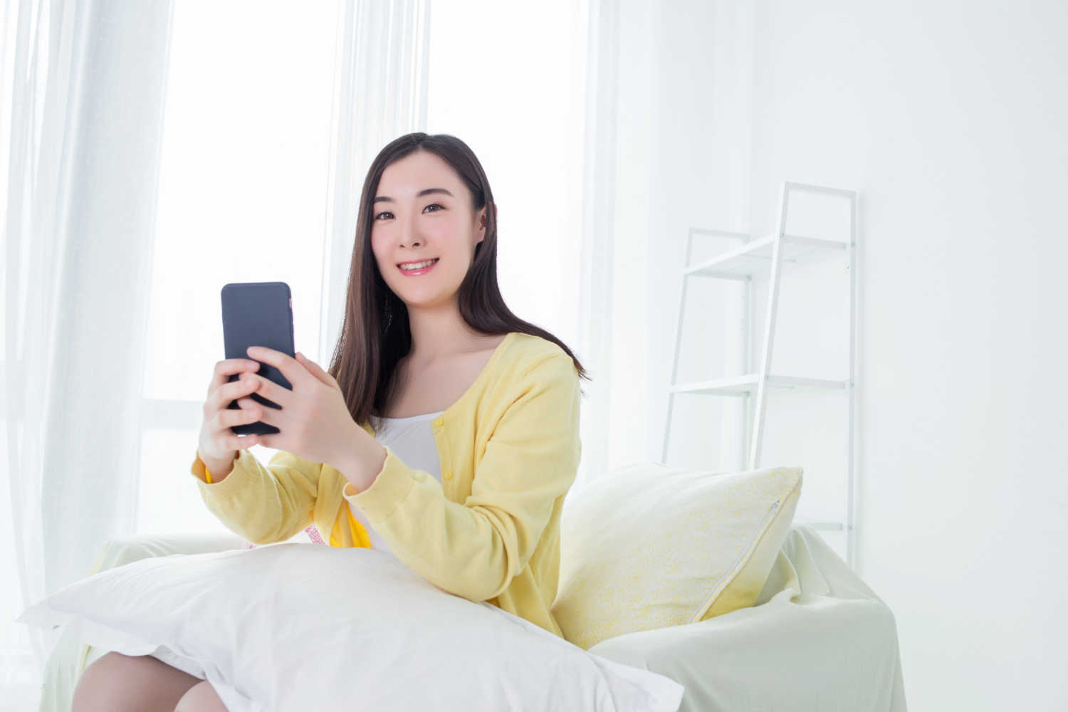 woman using mobile phone carefully