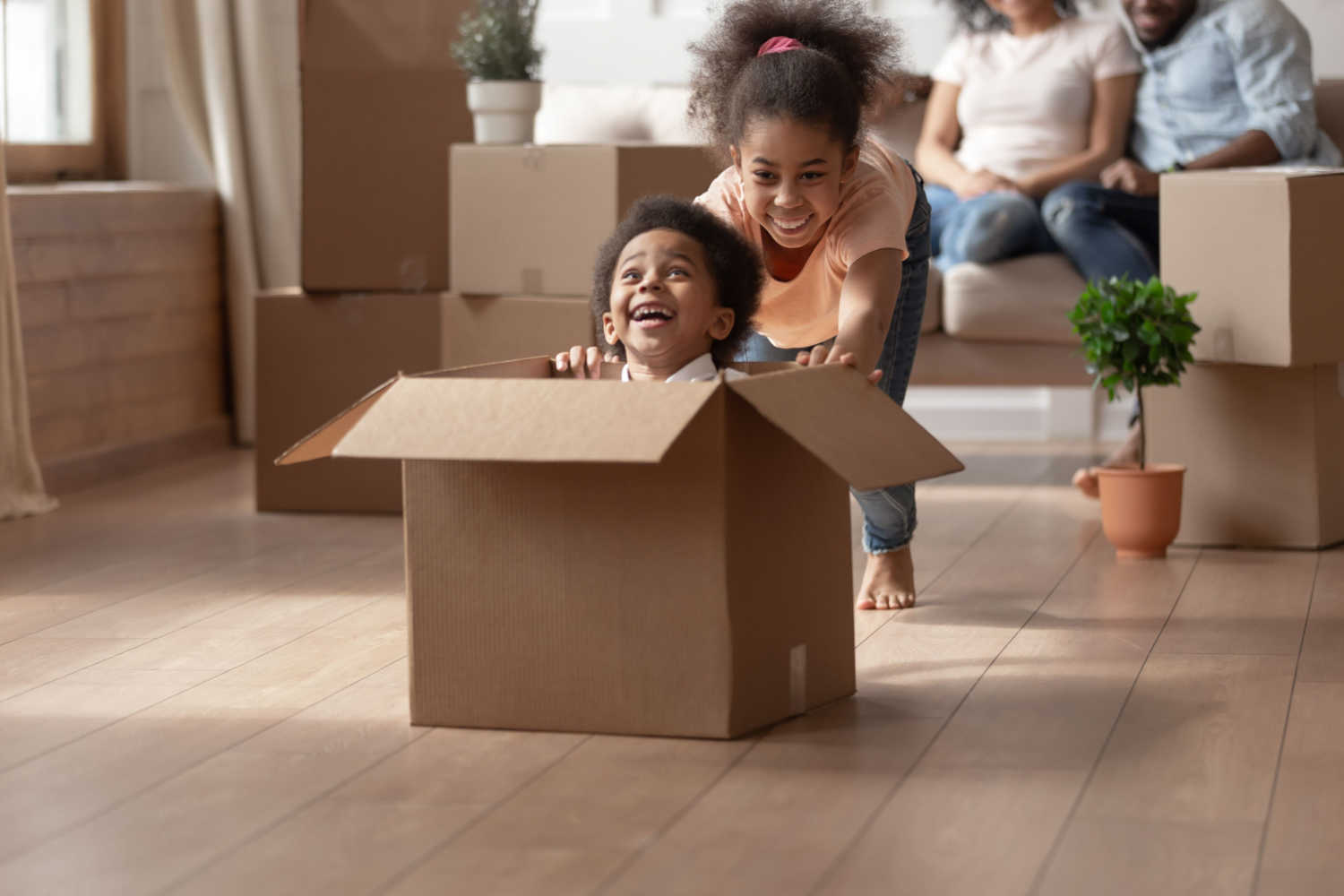 kids playing with cardboard box