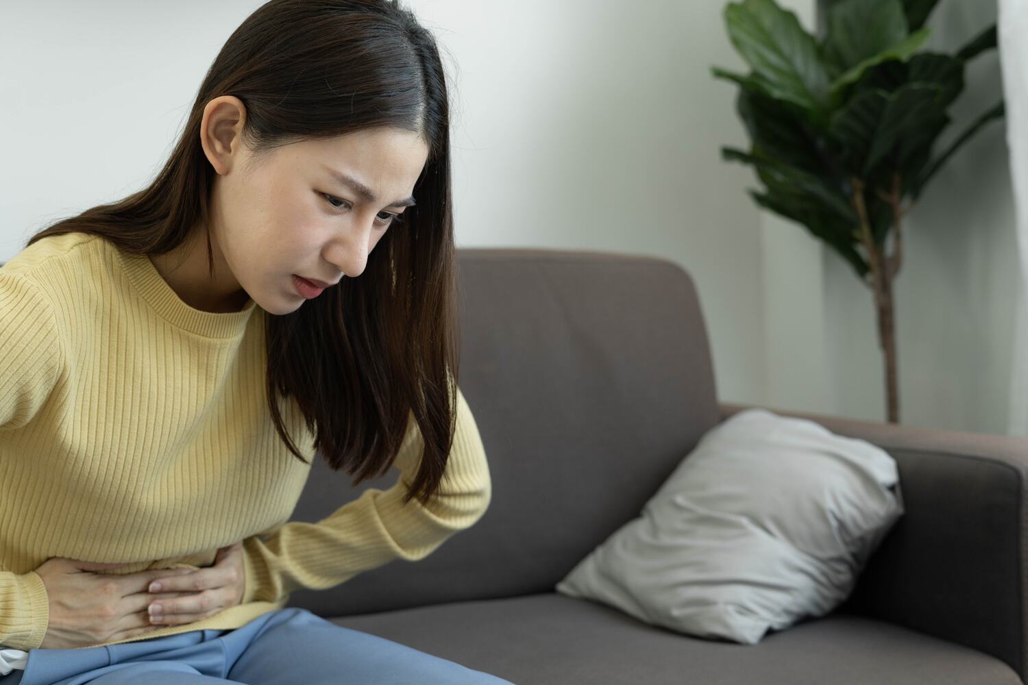 woman holding stomach