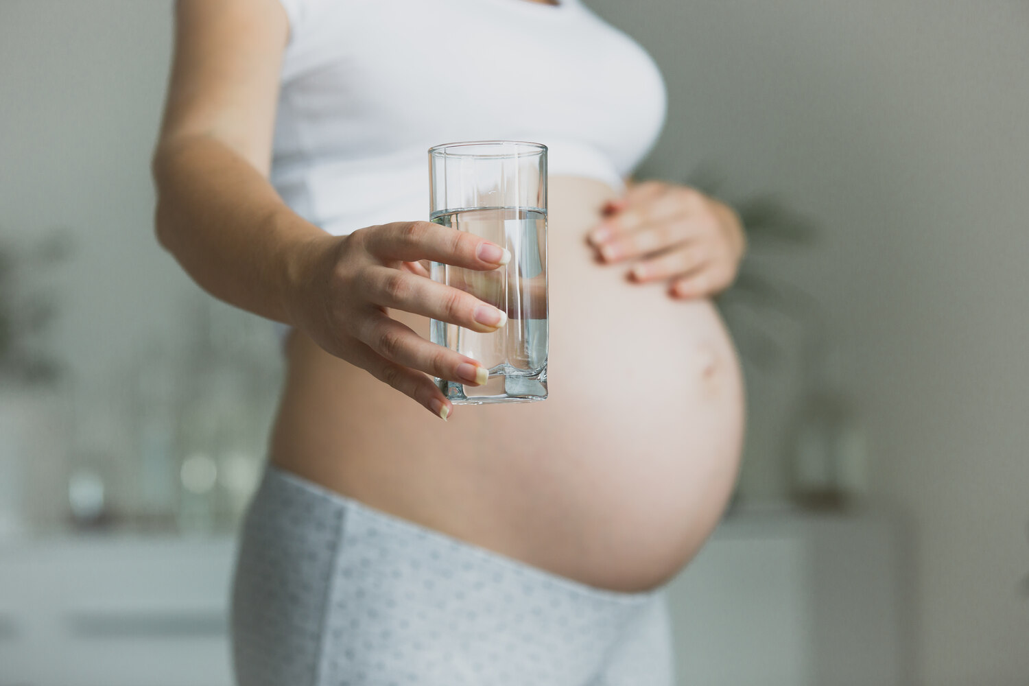 pregnant woman water glass