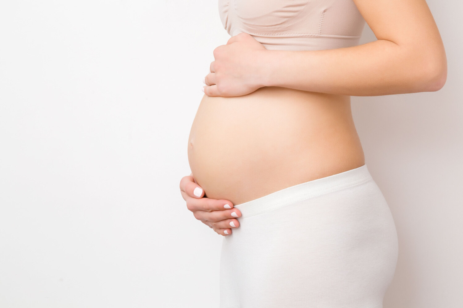 pregnant woman holding belly