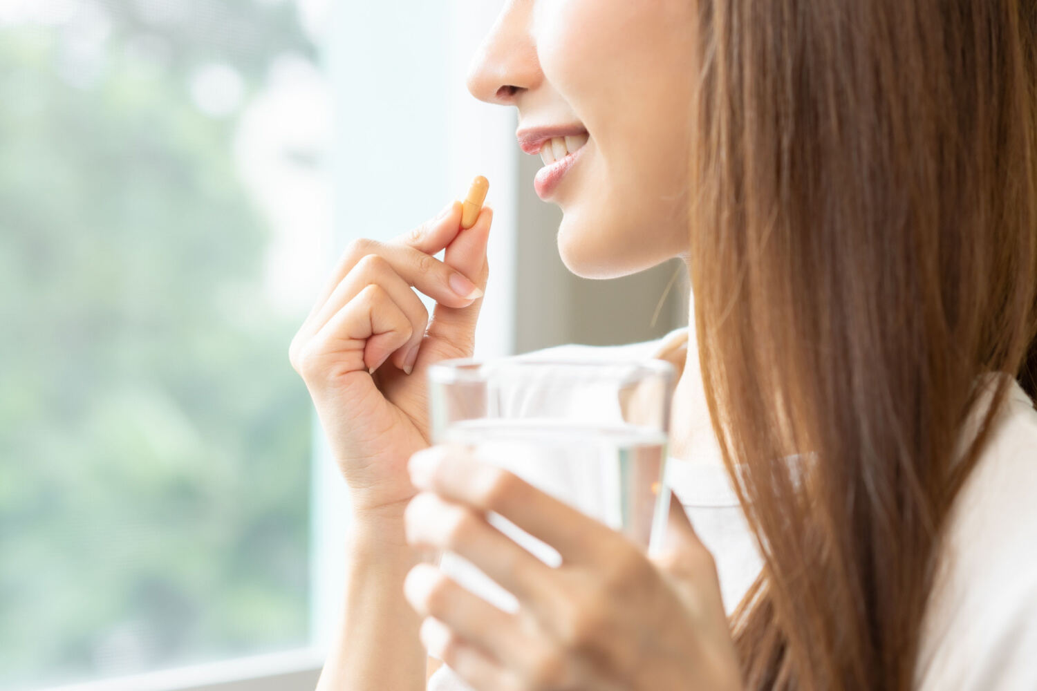 Woman taking vitamin c