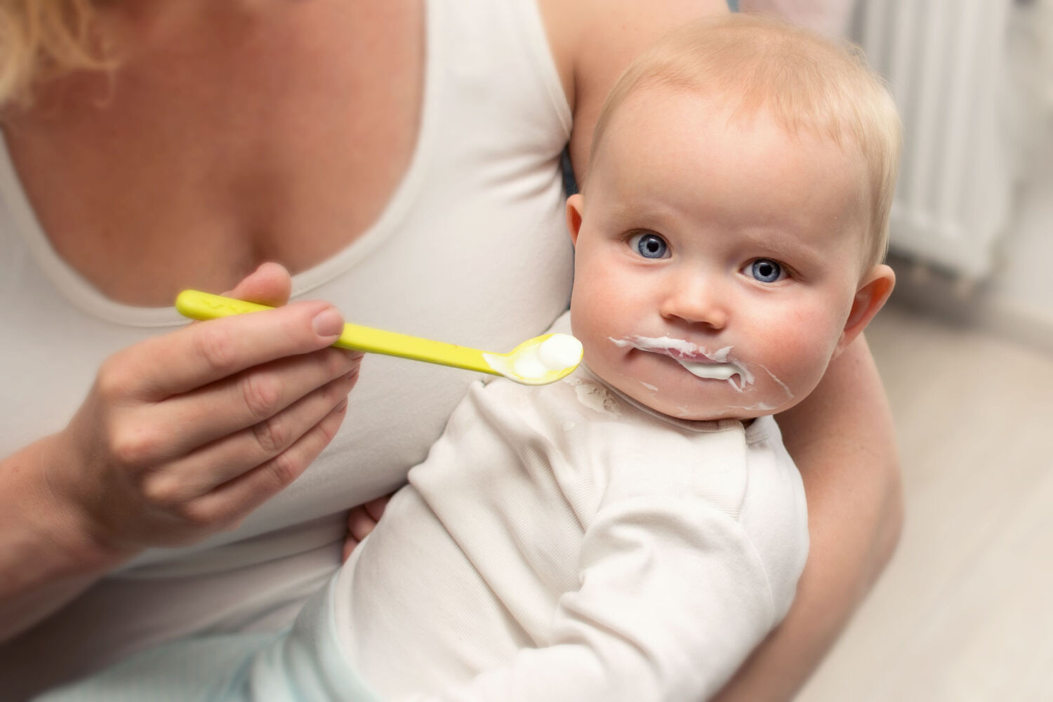 Baby eating yogurt