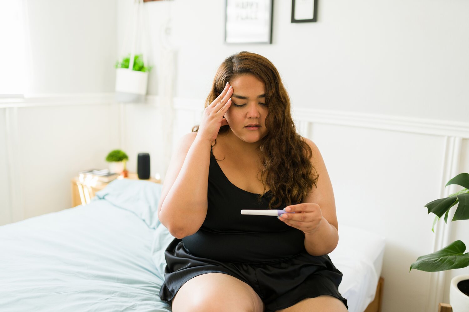 pregnant woman checking test kit