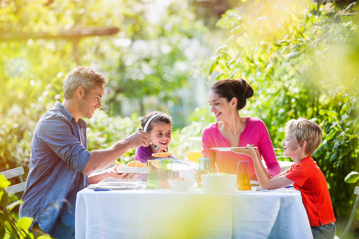 Children eating with family