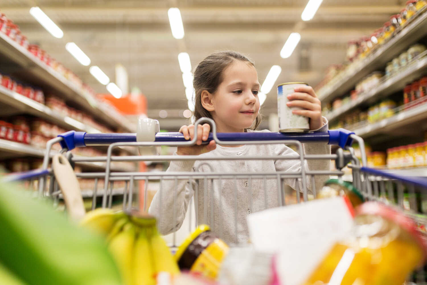 A girl reading food label