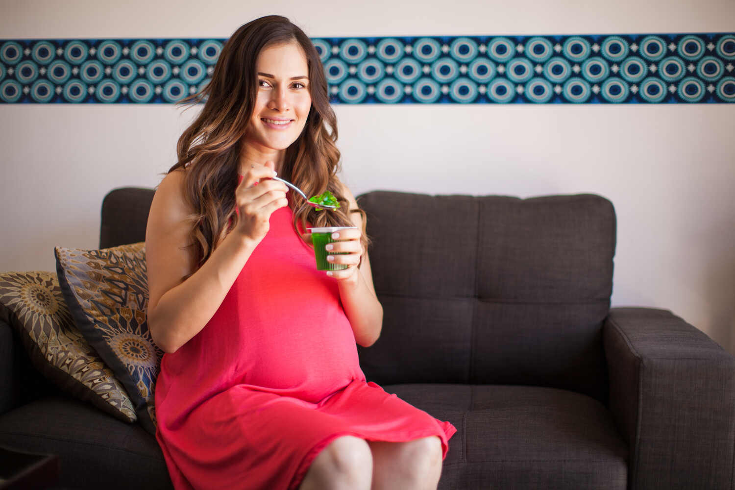 pregnant woman eating jelly