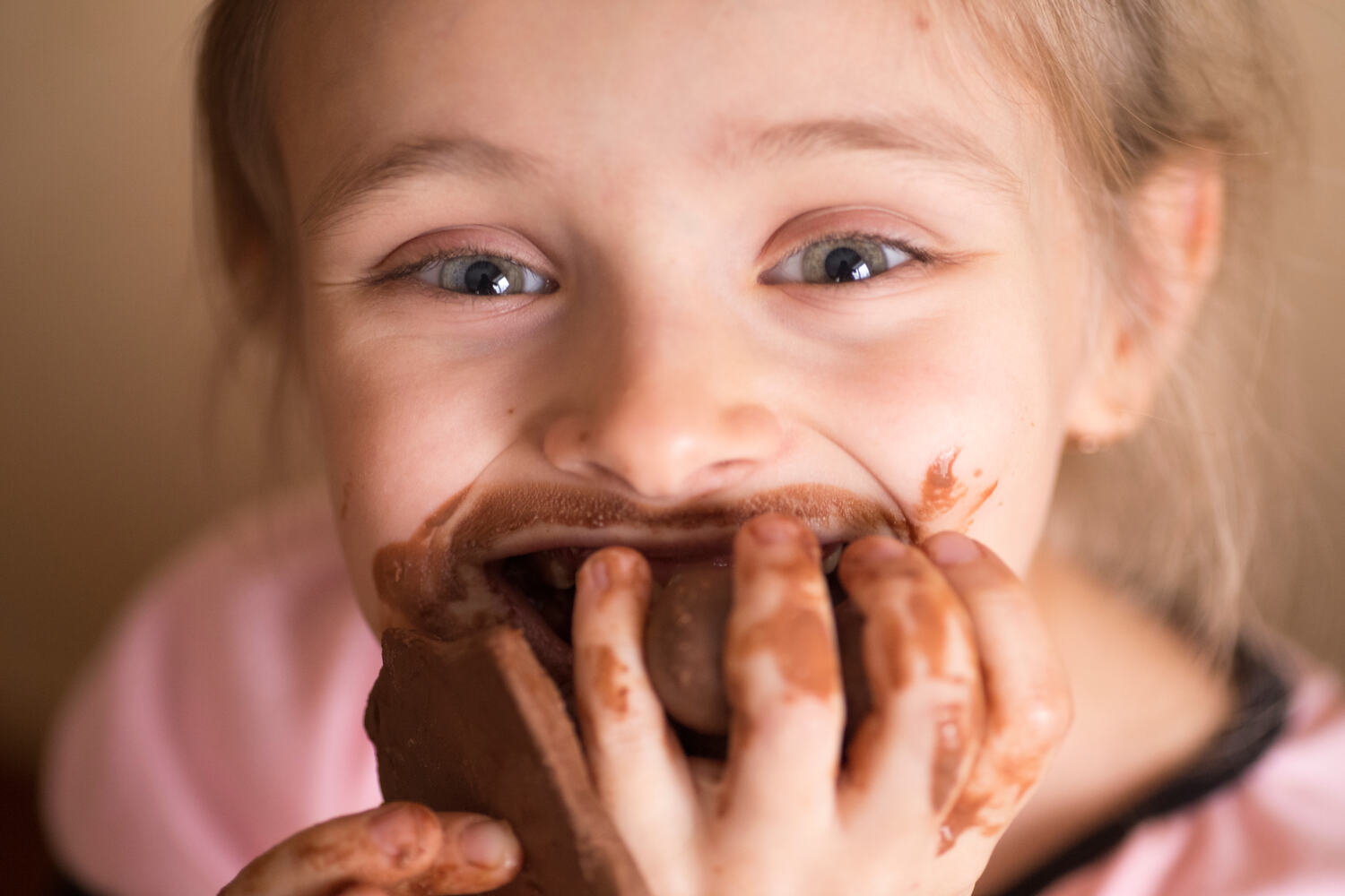 A girl eating sugary dessert