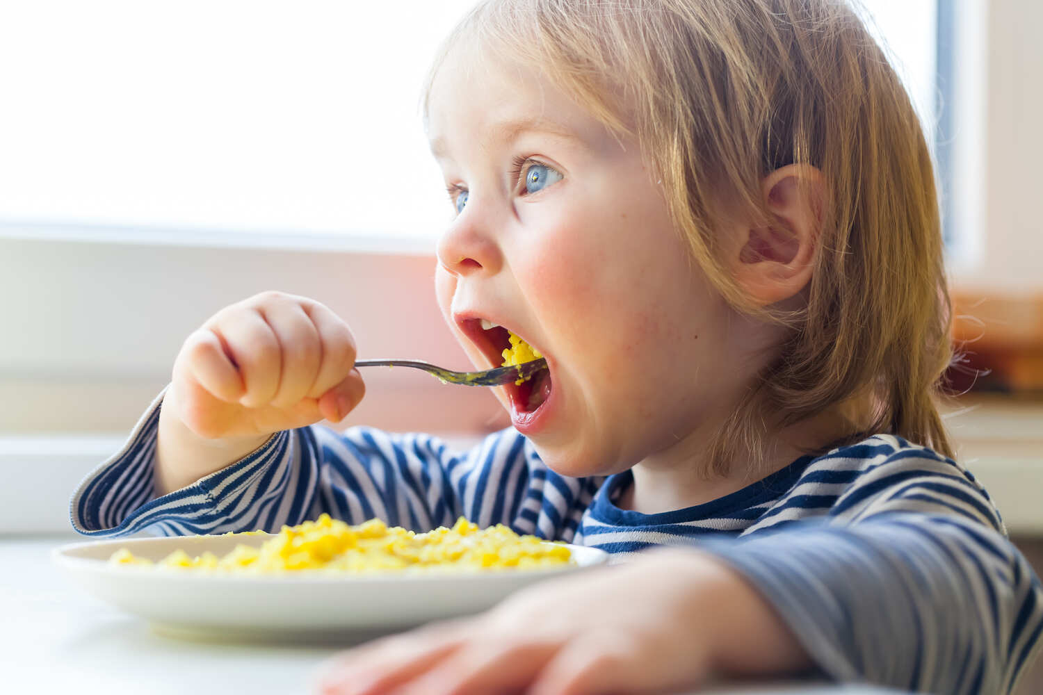 A toddler eating