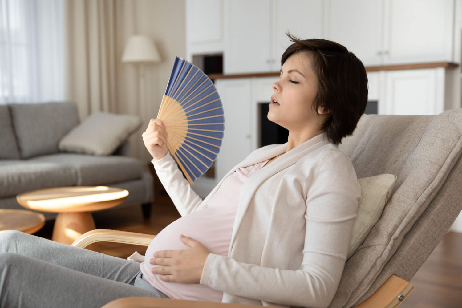 pregnant woman fanning