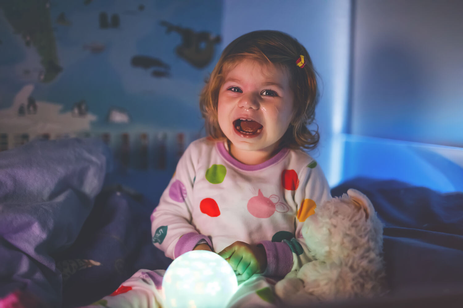 A toddler girl crying during bed time