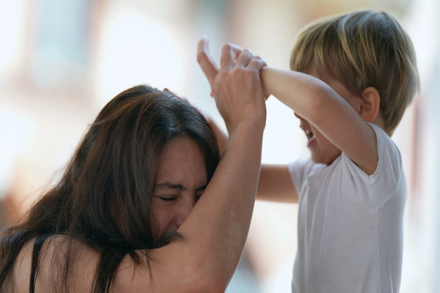 A toddler boy hitting his mother