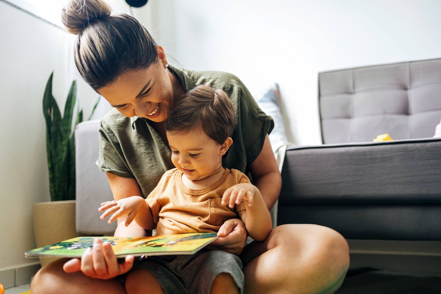 A mother reading to her toddler