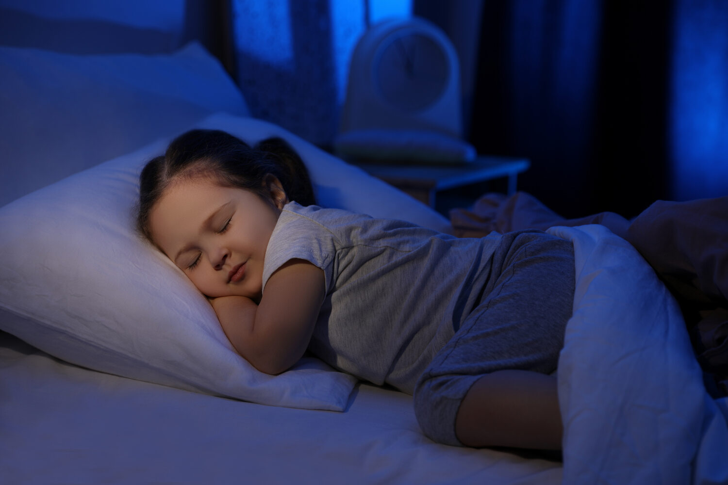 A little girl sleeping at night