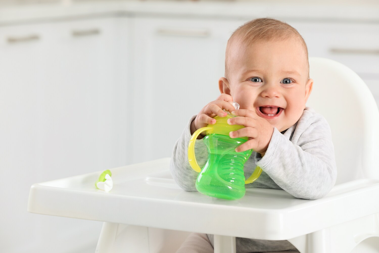 A toddler with a sippy cup