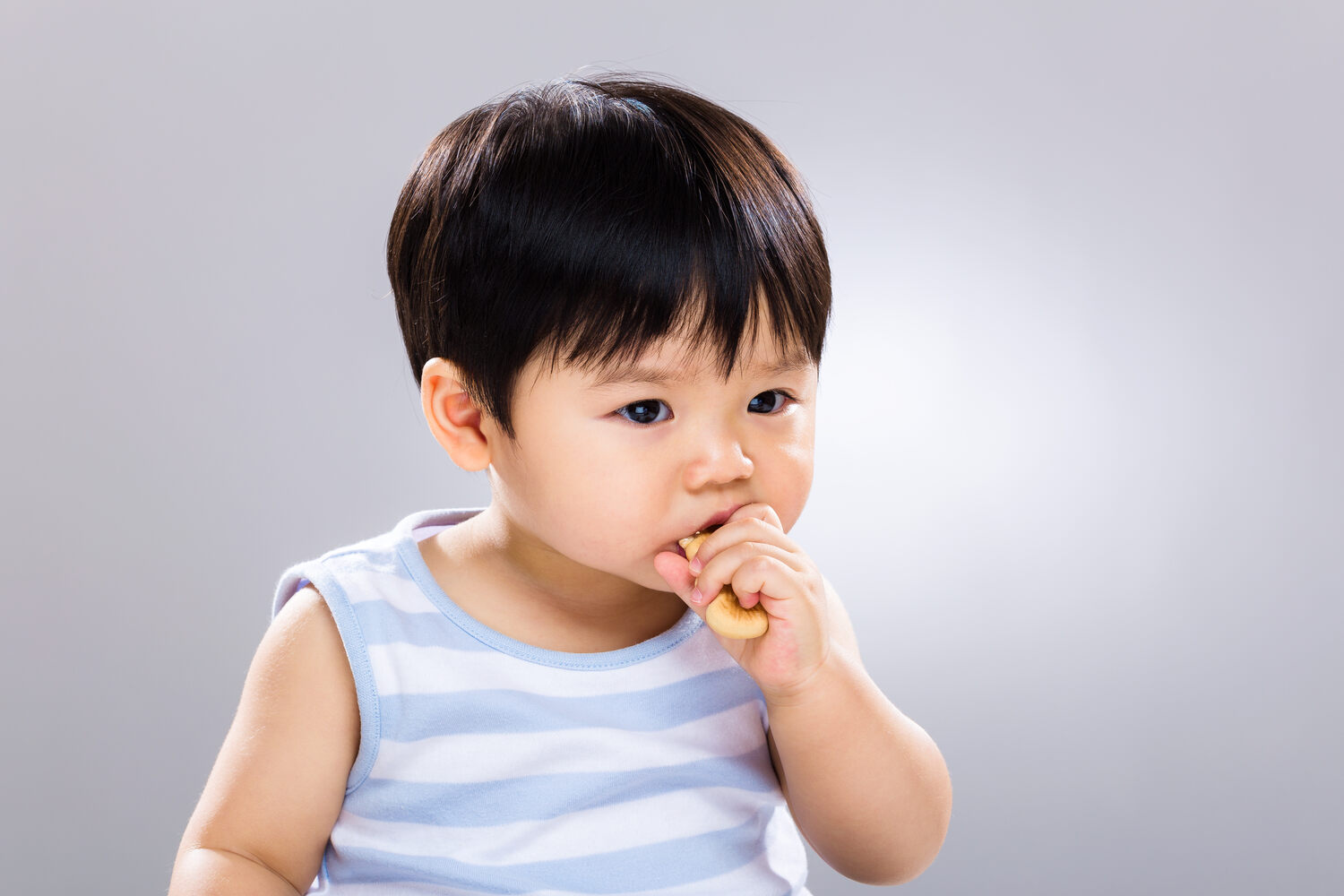 Toddler eating finger food