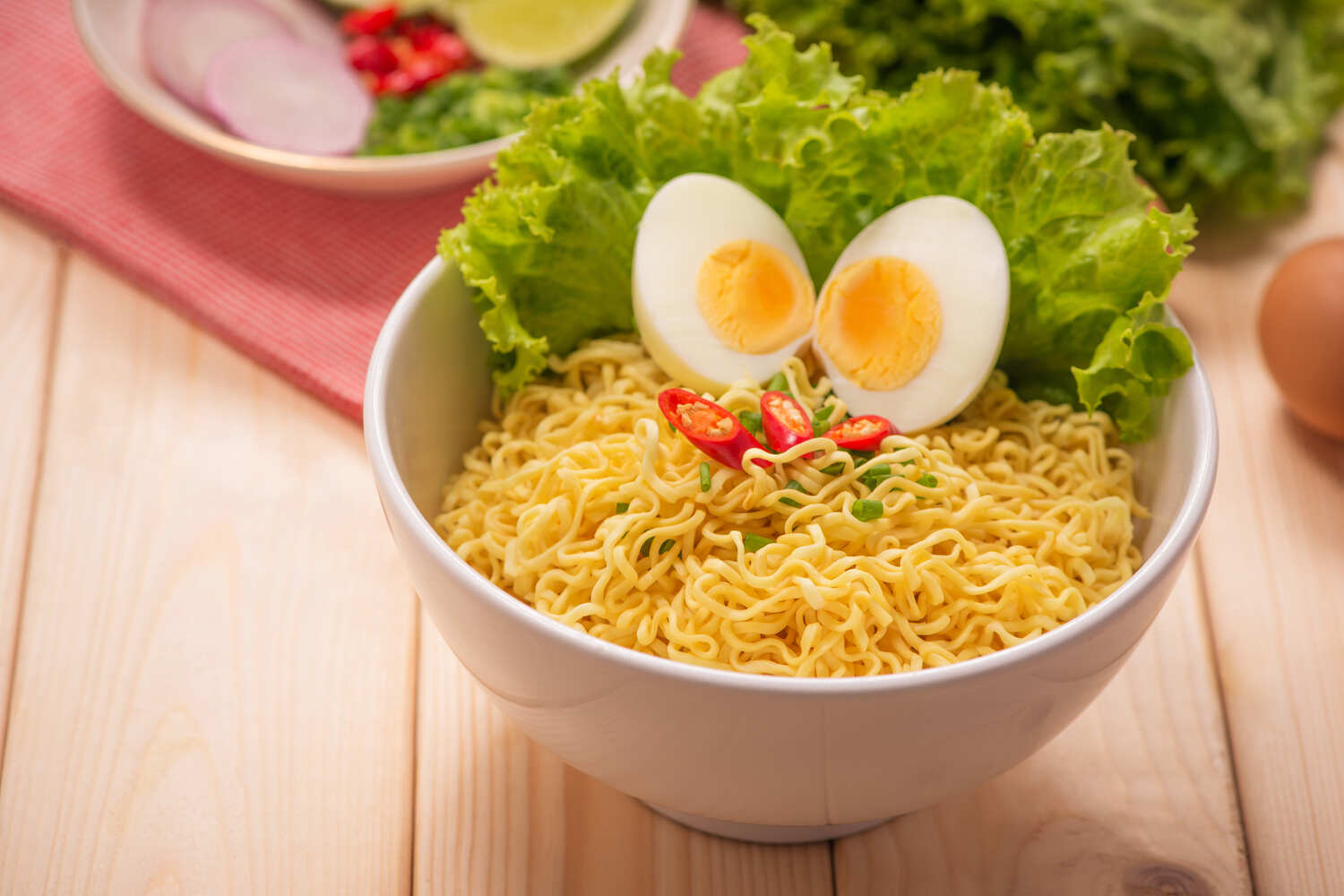 A bowl of noodles with boiled eggs