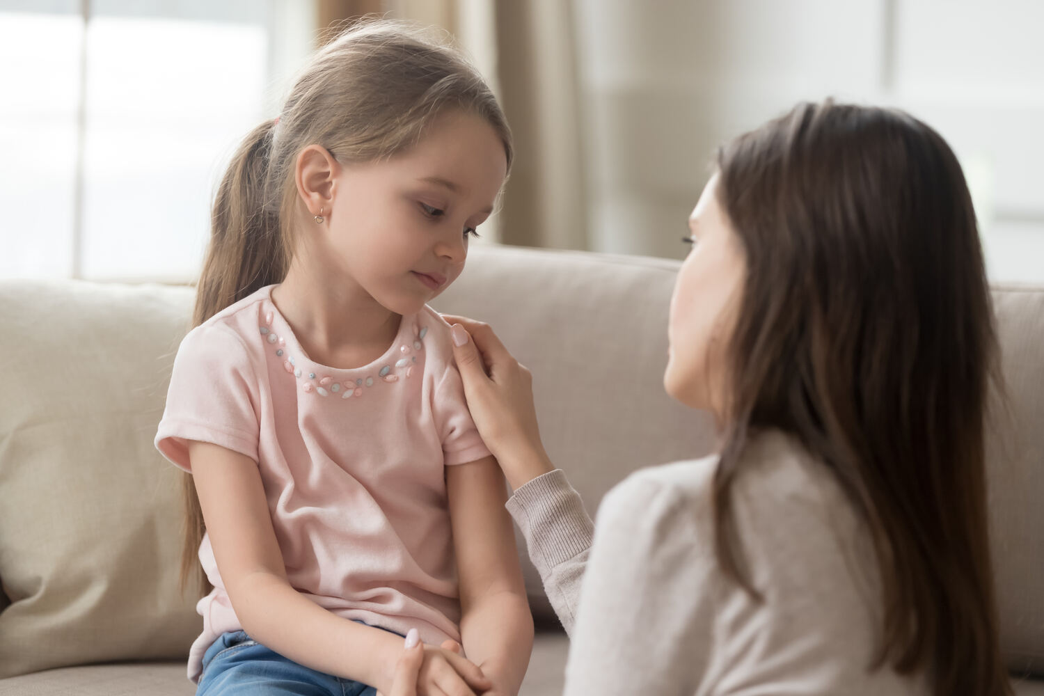 A mother talking to her daughter