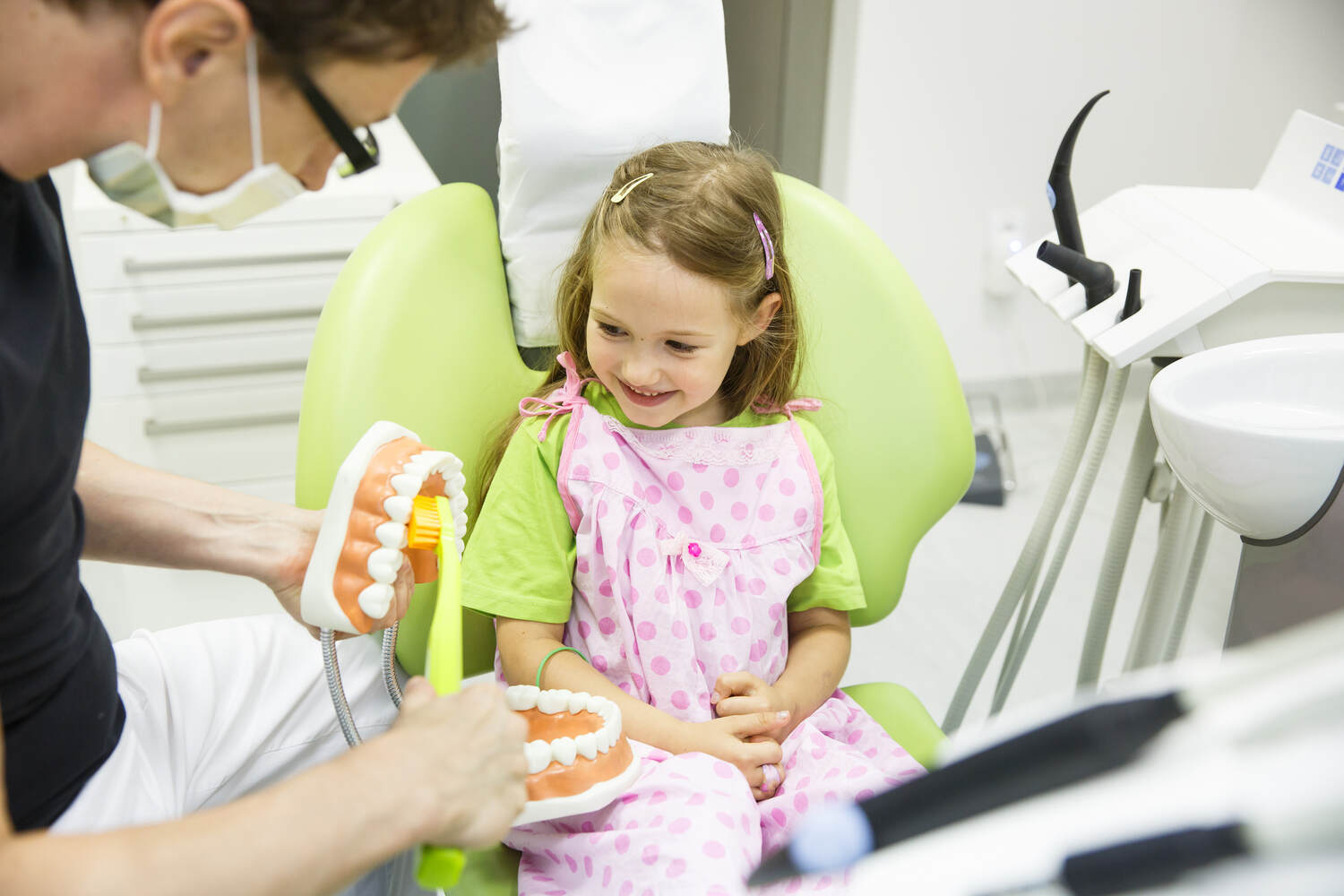 A little girl at pediatric dentist